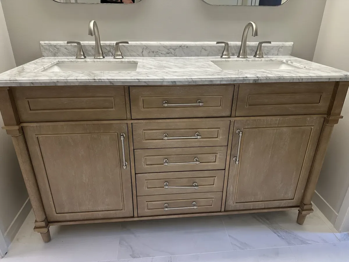 Custom bathroom vanity with marble top and brushed nickel hardware