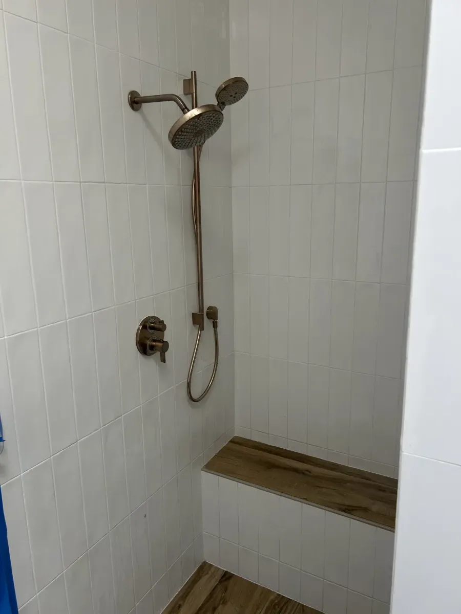 Shower fixture rough-in with brushed nickel rain head and hand shower