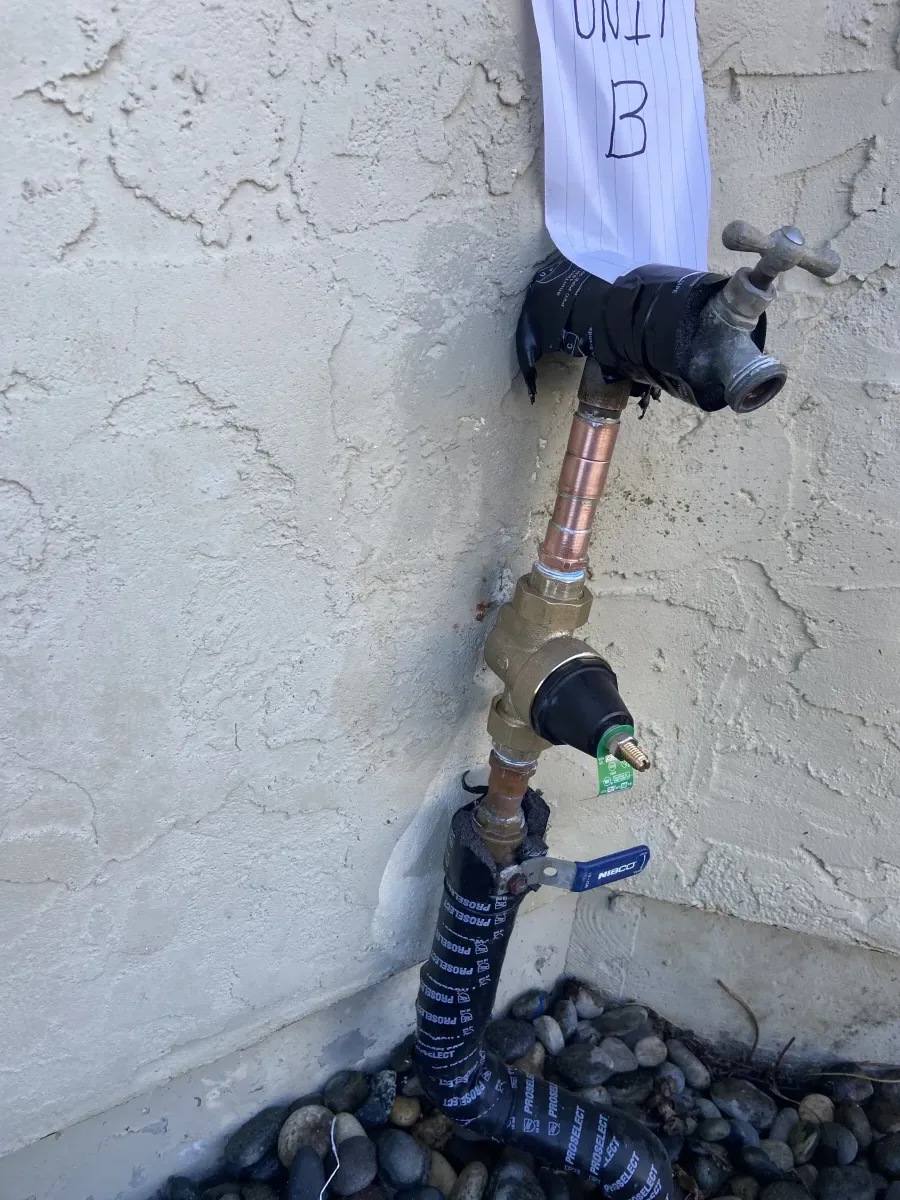 Hose bib and shutoff valve installation on exterior wall
