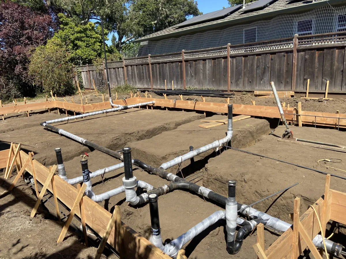 New construction underground plumbing rough-in with drain and vent pipes